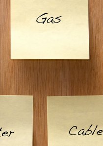 yellow sticky notes with reminders about utility bills written on them