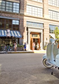 a vintage Vespa scooter parked outside a restaurant in Chicago
