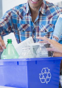 apartment renters placing plastic waste into blue recycling bin
