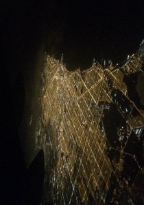 an aerial shot taken above Chicago at night showing the city traffic grid system