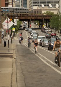 cyclists riding in bike lane on N Milwaukee Ave in River North neighborhood of Chicago