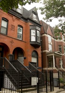 vintage red brick rowhouse apartments on a street in Chicago