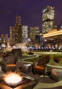 a downtown Chicago apartment building with a fire pit on the rooftop