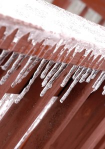 ice covering a banister on a Chicago apartment's outdoor porch