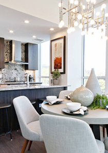 dining area and kitchen with marble waterfall counters in luxury apartment for rent in River North, Chicago