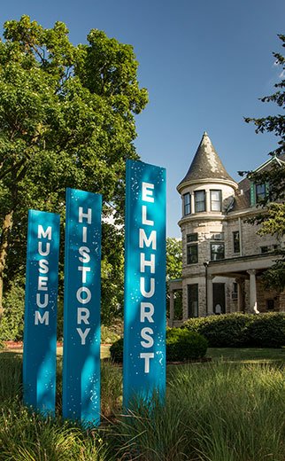 banner signs in front of historic white house in the Chicago suburb of Elmhurst Illinois