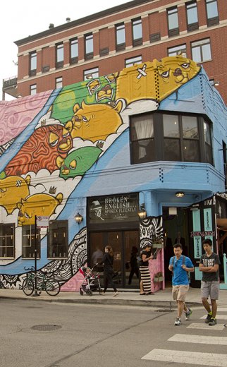 colorful painted mural exterior of old english taco pub on wells street in Old Town Chicago