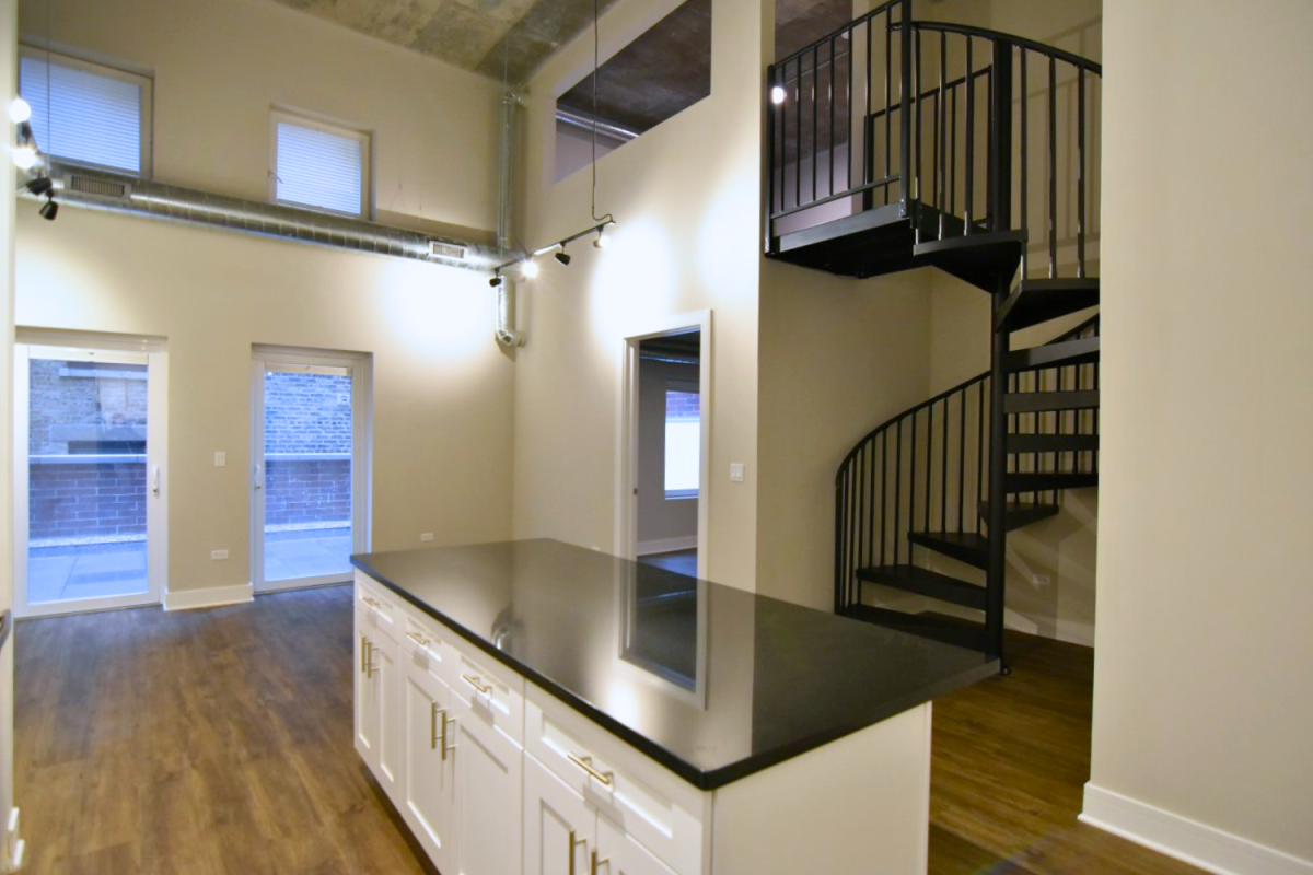 Loft with spiral staircase in Lakeview Chicago at the Eagle building