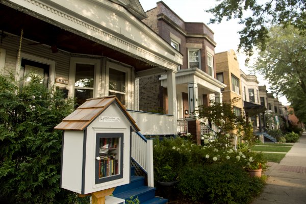 Community library box with apartments and front porches in St. Ben's Chicago