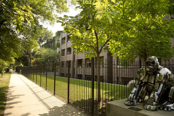 Metallic gorilla sculpture outside apartment buildings in Sheridan Park