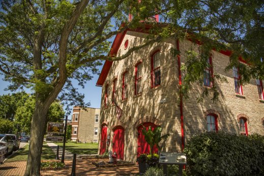 Heritage Museum painted red and brown on tree lined street in Skokie IL.